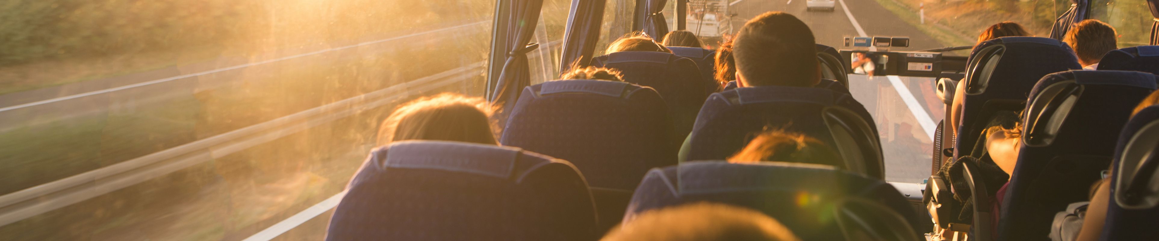 People riding on a tour bus 