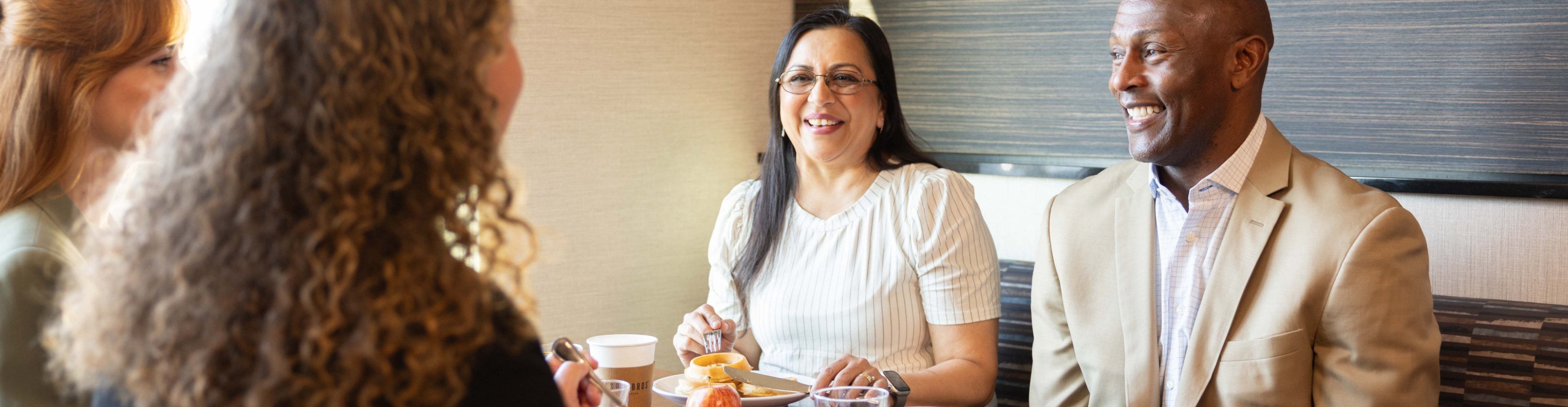 Business group at free hot breakfast