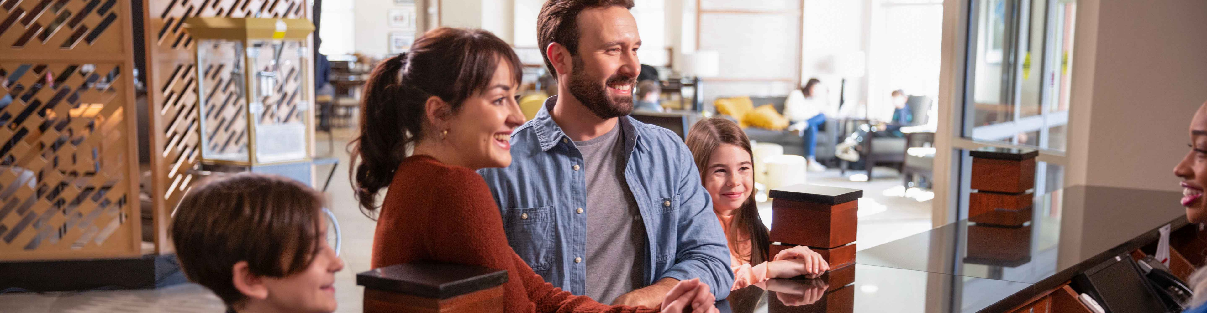 Family checking into Drury Hotel