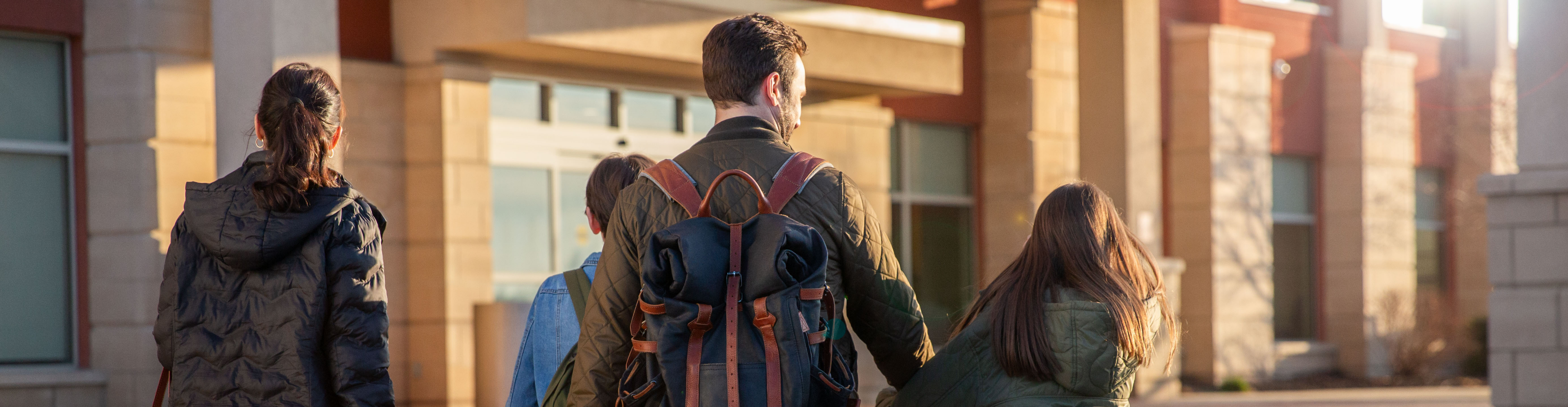 Family entering Drury Hotel